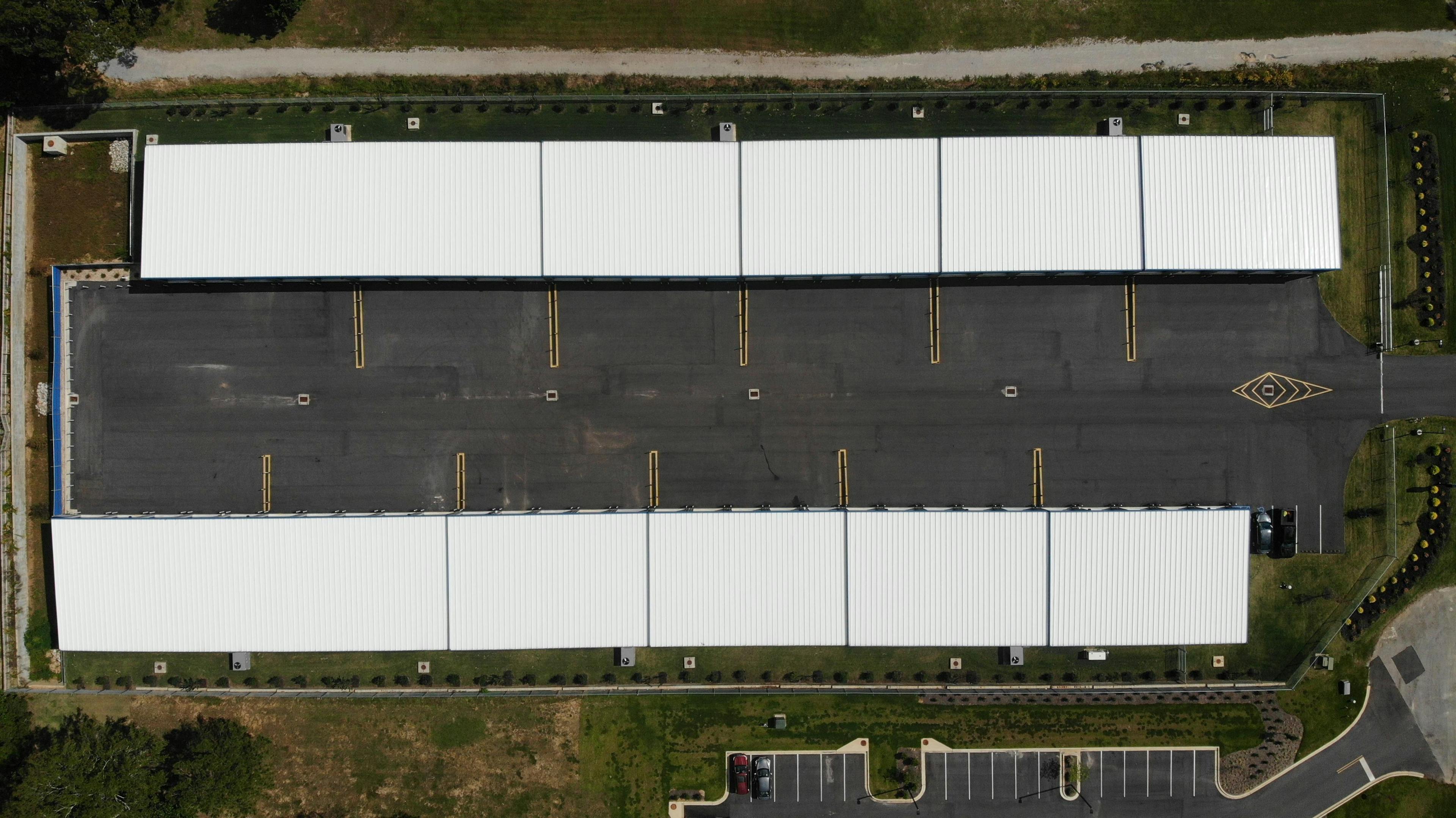 Overview of Spanish Fort Climate-Controlled Oversized Storage Facility showing wide driveway and large units